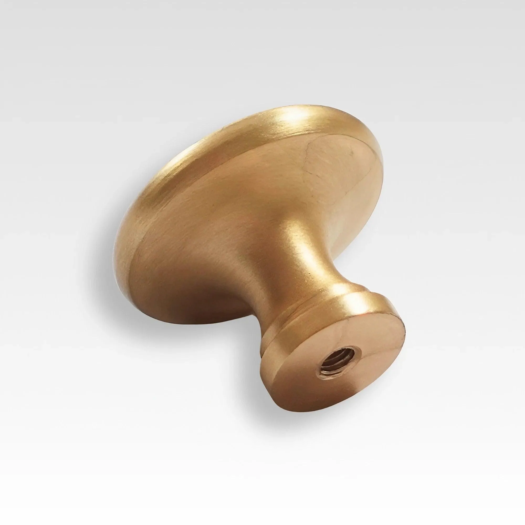 Minimalist Round Brass Knobs for Sleek Kitchen Cabinet Design